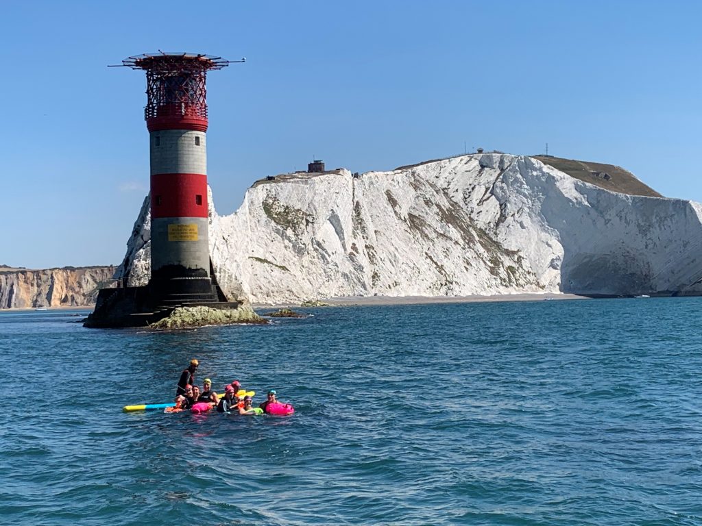 Swimmers at the Needles lighthouse
